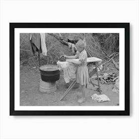 Child Of White Migrant Worker Ironing In Camp Near Harlingen, Texas By Russell Lee Art Print