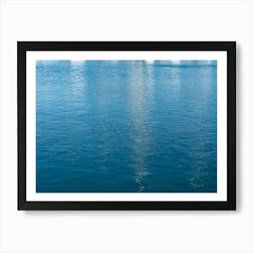 Reflections in blue sea water Art Print