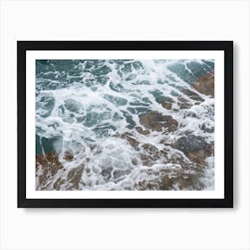 Sea water flows over the rocks Art Print