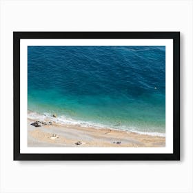 Aerial view of a beach and blue sea water Art Print