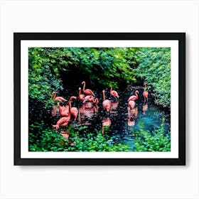 Flamingos in a Tranquil Lagoon. A serene scene of vibrant pink flamingos wading and interacting in a lush, green lagoon surrounded by dense foliage. The water reflects their elegant forms, creating a harmonious connection between nature and wildlife. 5 Art Print