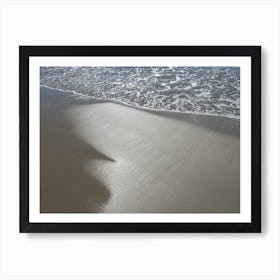 Sea water and reflections in wet sand Art Print