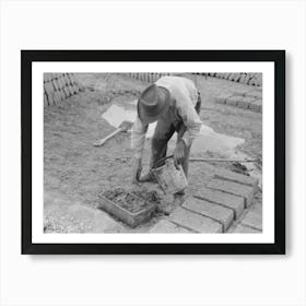 Adding A Little Water To Adobe Mixture In Wooden Form In Process Of Making Adobe Bricks, Chamisal, New Mexico Art Print