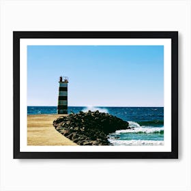 Lighthouse On The Beach Art Print