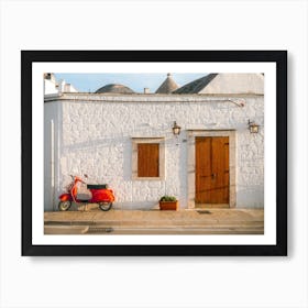 Red Vespa parked in front of a trulli | Puglia | Italy Art Print