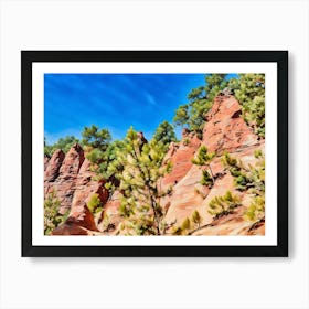 Ochres Land Majestic Cliffside Forest. This image showcases a stunning cliffside landscape adorned with lush green trees. The rocky formations exhibit a range of warm hues, from sandy yellows to deep reds, creating a striking contrast against the vibrant blue sky. The scene captures the beauty of nature's rugged terrain and the resilience of trees growing on steep, rocky surfaces. 4 Art Print