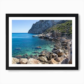 Turquoise sea water and rocky beach Art Print