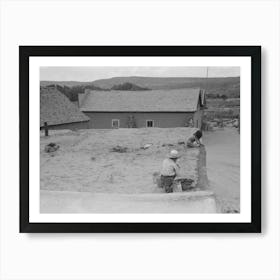 Spanish American Children Replastering Corner Of Roof Of Adobe House, Costilla, New Mexico By Russell Lee Art Print