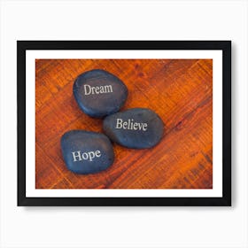 Black Inspirational Pebble Stones With The Words Dream, Believe And Hope On Wooden Background 1 Art Print