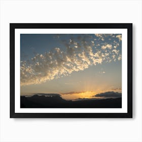 Clouds, sunlight and mountains at sunset Art Print