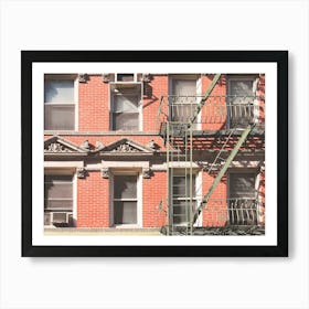 New York, USA I Little Italy building in red brick with fire escape and window for minimalist and geometric architecture photography for a Christmas and holidays atmosphere in winter interior decoration Art Print