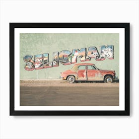 Route 66, USA I Vintage American car in front of a street art typography photography wall in Seligman in Arizona in the retro vintage american countryside during travel road trip on historic Route 66 in California Art Print