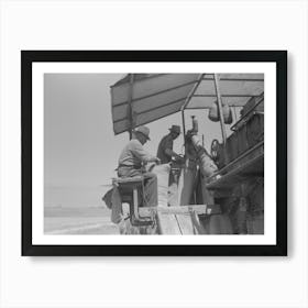 Walla Walla County, Washington, Men On The Combine In A Wheat Field, The Man In The Foreground Is Sewing Up Th Art Print