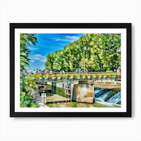 Canal du Midi in Narbonne during Spring. This image shows a picturesque scene of people gathered on a flower-adorned bridge over a small waterway with a gentle waterfall. The bridge is surrounded by vibrant greenery, with tall trees and lush plants. The bright blue sky and cheerful atmosphere suggest a pleasant, sunny day in a park or garden setting. Art Print