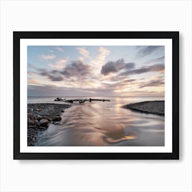 Sunset with river and driftwood Art Print