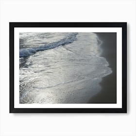 Sea water and silver reflections in wet sand Art Print