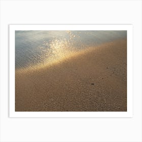 Reflections of sunlight on the sandy beach Art Print