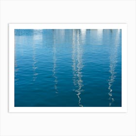 Reflections of sailboats in blue sea water Art Print