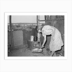 Girl Tending Fire In Shack Home, Tin Town, Caruthersville, Missouri By Russell Lee Art Print