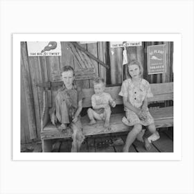 Children Of Agricultural Day Laborers Sitting On Bench In Front Of Small Store Near Vian, Oklahoma By Russell Lee Art Print