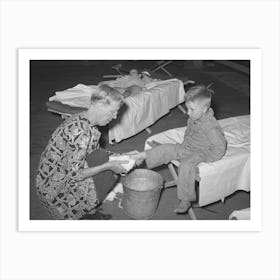 Wpa (Work Projects Administration) Nursery School Attendent Washing Dirty Feet Of The Children Before They Their Art Print