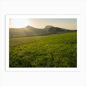 Sunset over a green field Art Print