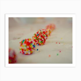 Close Up On White Chocolate Balls Covered With Candies Arranged In A Row Art Print