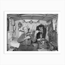 Mr, Bias Playing The Fiddle In His Trailer Home, He Is A Former Cowboy Who Travels Over The Country, He Has A Small Art Print