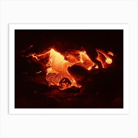 Hot magma emerges from a crack in the earth Art Print