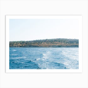 Land over blue waves Art Print