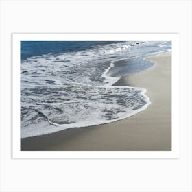 Elegant waves on the sandy beach Art Print