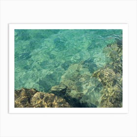 Clear, turquoise sea water and rocks Art Print