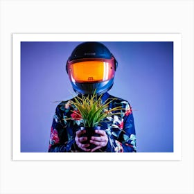 Portrait In A Futuristic Helmet Cradling A Luminescent Plant Bright Orange Against A Shadowed Back Art Print