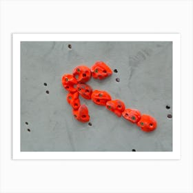 Red Climbing Holds In The Shape Of An Arrow On Grey Wall Art Print
