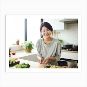 Happy Asian Woman In Kitchen Art Print