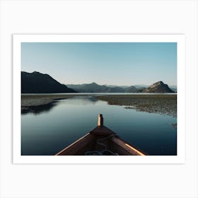 Boat on a lake reflection Art Print