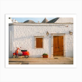 Red Vespa parked in front of a trulli | Puglia | Italy Art Print