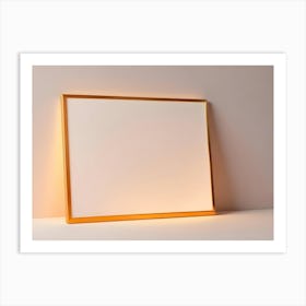 A Golden Picture Frame Against A Light Colored Wall And White Surface Art Print