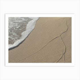 Sea water and traces of waves on the beach Art Print