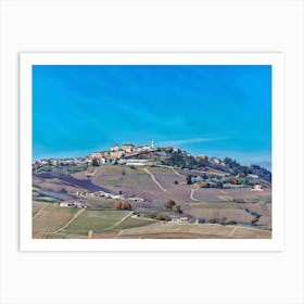 Langhe Rolling Vineyards in Early Spring. Langhe, Italy. An aerial view of beautifully contoured vineyards, showcasing rows of neatly planted vines stretching across rolling hills. The alternating shades of green and earthy tones create a mesmerizing pattern, highlighting the precision and artistry of vineyard cultivation. This serene landscape captures the essence of rural life in a wine-producing region. 1 Art Print