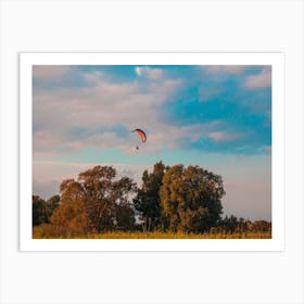 Motorized Paraglider Flying In Rural Area During Sunset Art Print