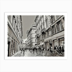 Bustling Streets of Florence. A monochromatic view of a lively street in Florence, Italy, where people stroll past historic buildings and shops. The scene captures the timeless charm and energy of Florence’s architecture and city life. Art Print