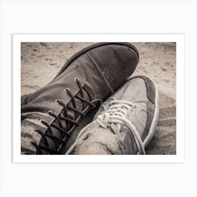 Shoes Of Man And Woman Lying Next To Each Other On The Sand Art Print