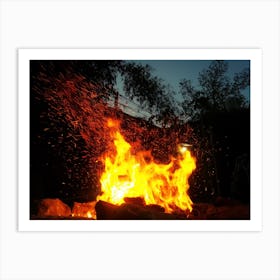 Sparks Bounce Off From A Bonfire At Night After A Log Thrown Into It Art Print