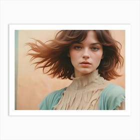 A Portrait Of A Young Woman With Windswept Hair, Looking Directly At The Camera Art Print