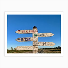 A Weathered Wooden Signpost At A Crossroad Its Arrows Pointing In Various Directions With Hand Pain (1) Art Print