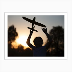 Silhouette Of A Girl Holding A Toy Plane Art Print