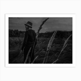 A Man In A Field With Spikelets Against The Background Of The Forest Art Print