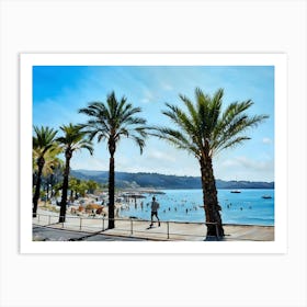 Palm Trees Beach Scene in French Riviera. A picturesque beach scene unfolds with a row of palm trees framing the view. The azure sky stretches above, while the clear blue water laps at the shore. A man in blue shorts jogs along the boardwalk, passing by a lively crowd of people enjoying the sun and sand. Colorful umbrellas dot the beach, adding a splash of vibrancy to the scene. Art Print