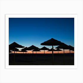 Silhouette Of Umbrellas At Sunset Art Print